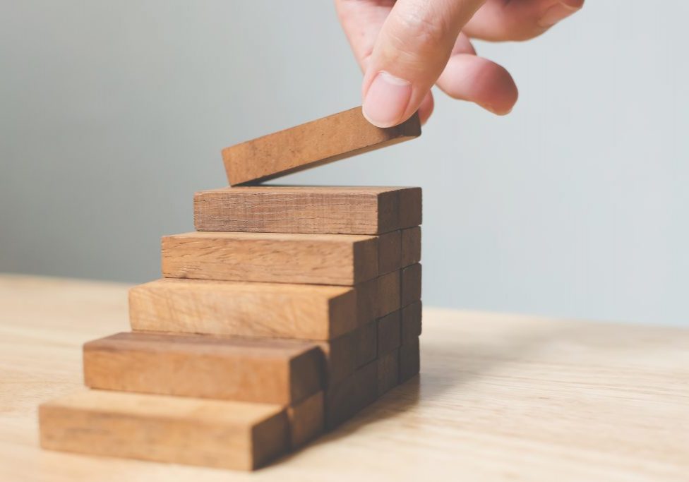 Hand,Arranging,Wood,Block,Stacking,As,Step,Stair.,Ladder,Career progressive rehabilitation