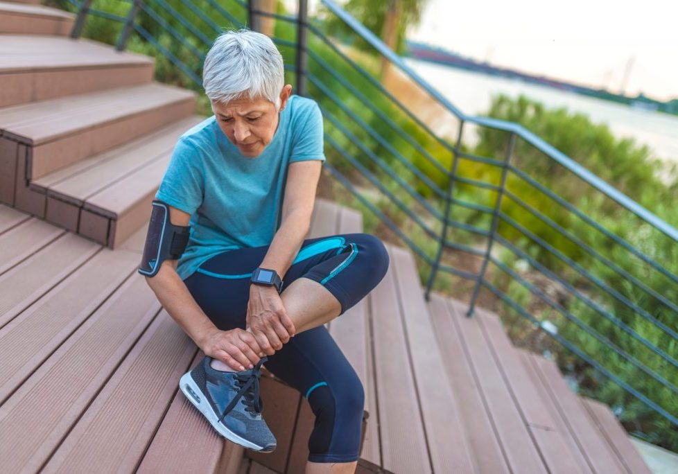Senior,Woman,In,Pain,While,Running,In,Park,,Knee,Injury. high-energy fractures