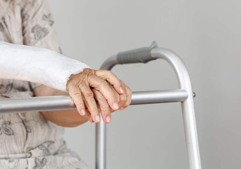 Elderly patient waiting on her walker